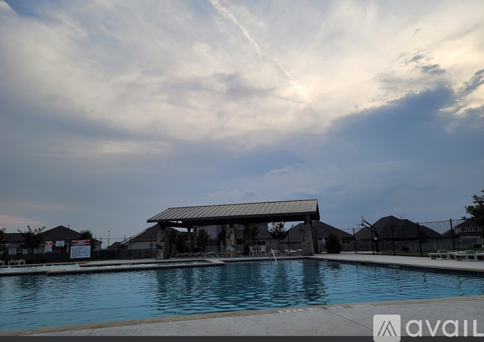 A pool with a building in the background and the word "available" in the bottom right corner.