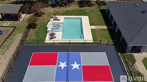 A pool with Texas flag painted on the ground.