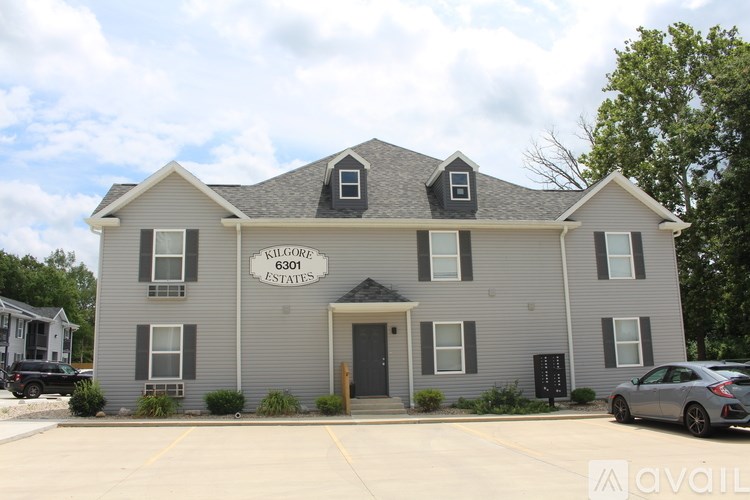 A building with the words "Riverplace Estates" on the front.