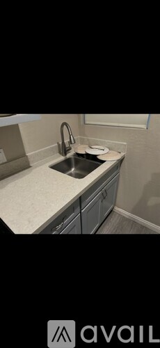A bathroom with a toilet and a shower stall.