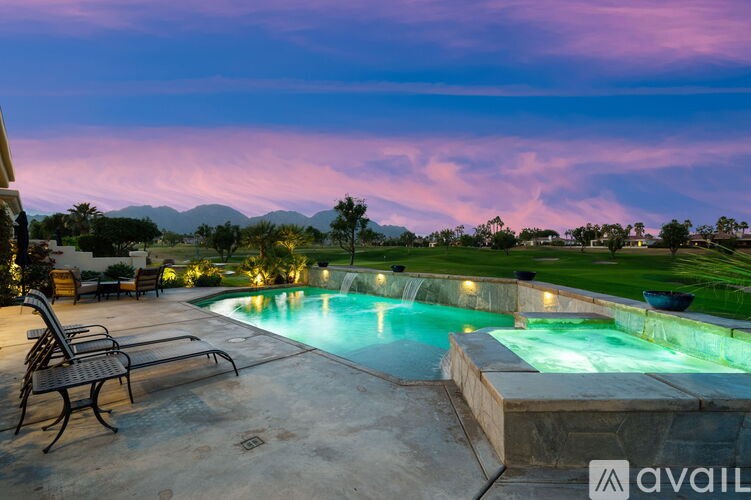 A pool with a bench next to it.