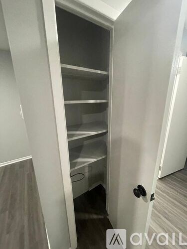 A white door with a glass panel and a handle.