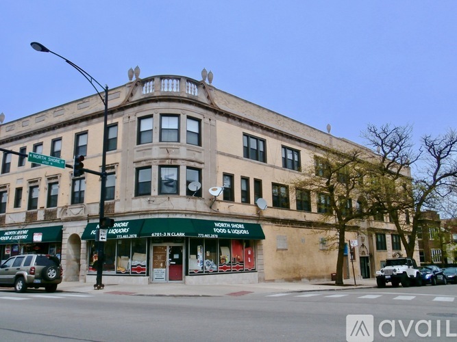 A street view of a building with a green awning and a sign that reads "DANGEROUS FOOD & SMOKES".