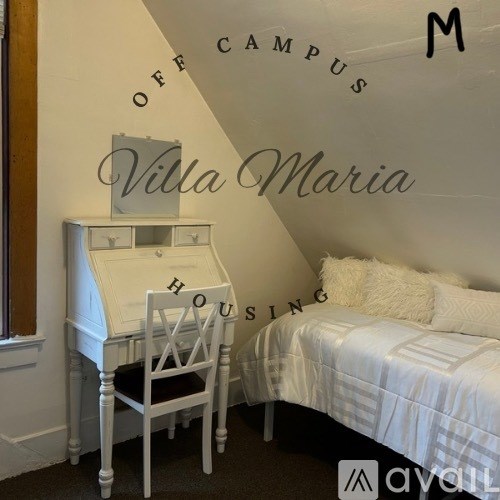 A white bedroom with a bed, desk, and chair.