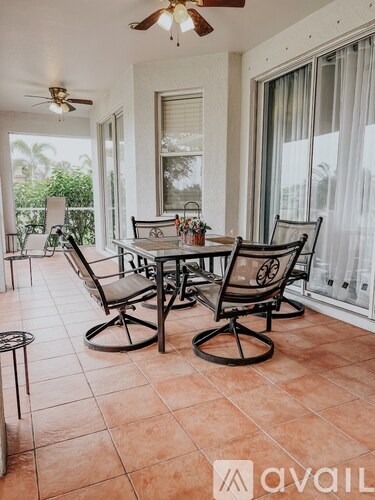 A patio with a table and chairs is shown.