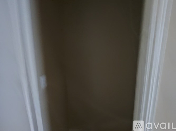 A wall with a light switch is visible.