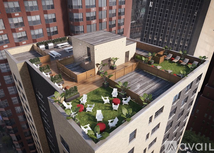 A modern building with a green roof terrace.