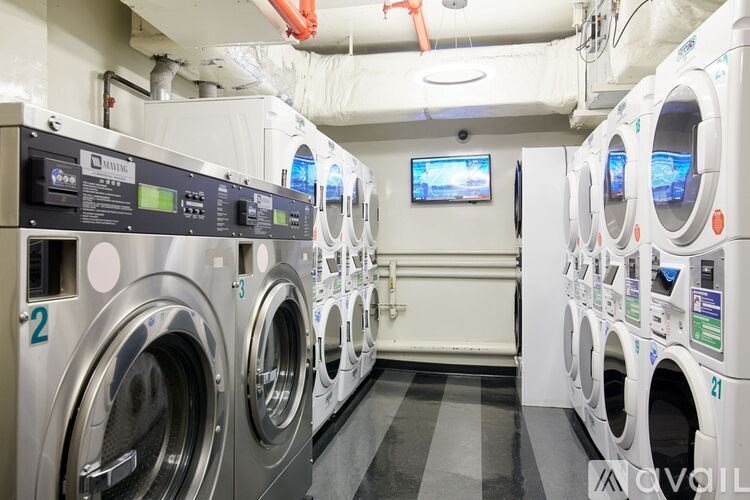 A row of washing machines in a laundromat.