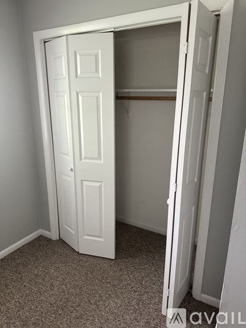 A white closet door is open.