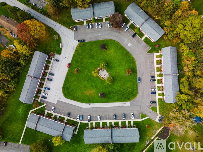 A park with a grassy area and a walking path.