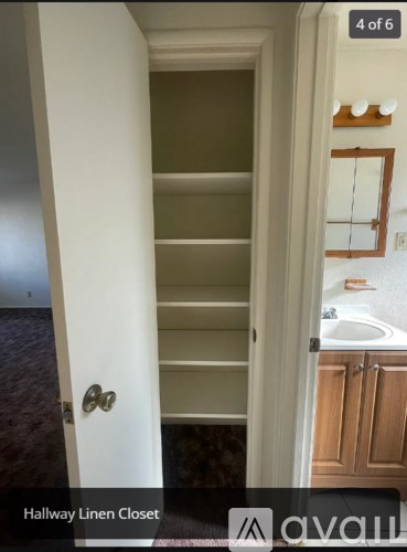 A white door with a Hallway Linen Closet.