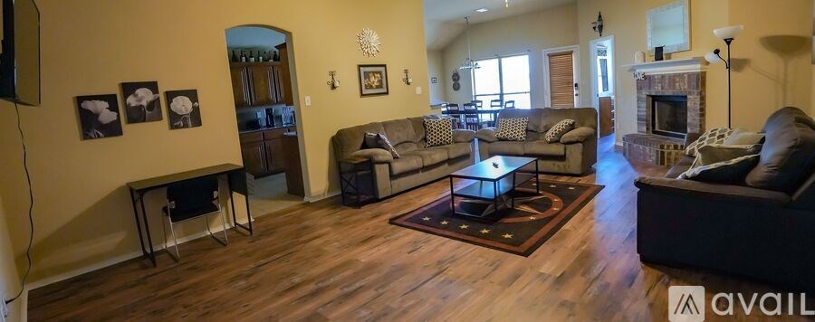 A living room with a fireplace and a couch.
