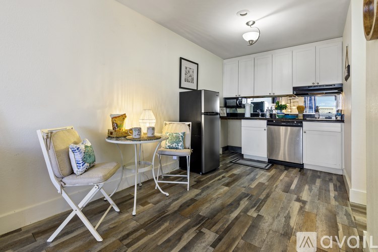 A kitchen with a refrigerator, stove, and oven.