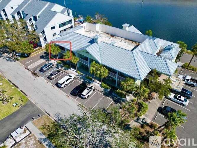 A building with a parking lot in front of it.