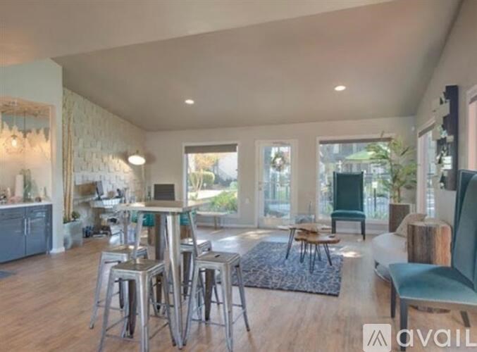 A modern kitchen with a dining area and a bar.
