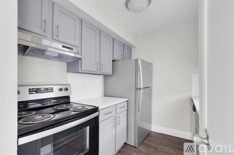 A kitchen with a stove, oven, and refrigerator.
