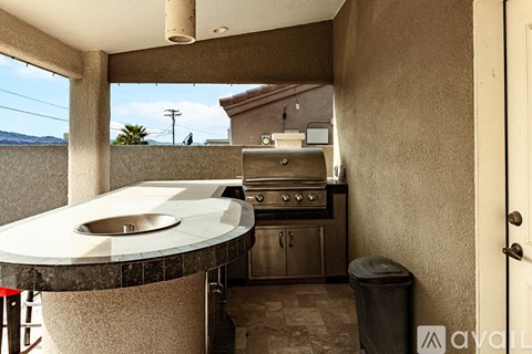 A kitchen with a round table and a built in oven.