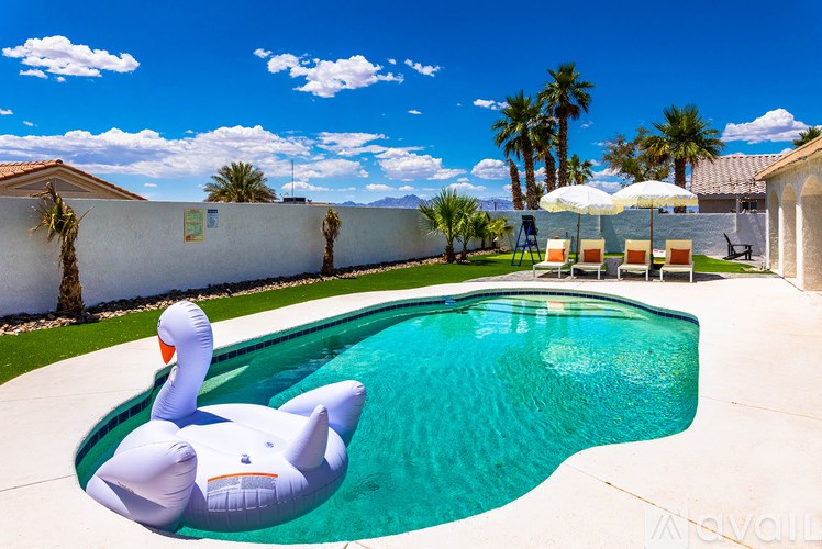 A pool with a swan float in it.