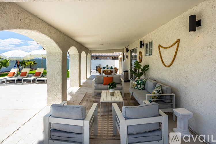 A patio with a table and chairs is available for rent.