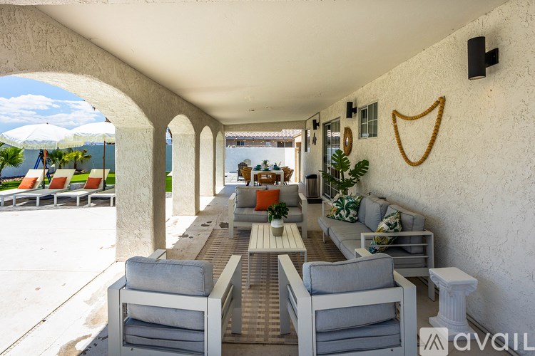 A patio with a table and chairs is available for rent.