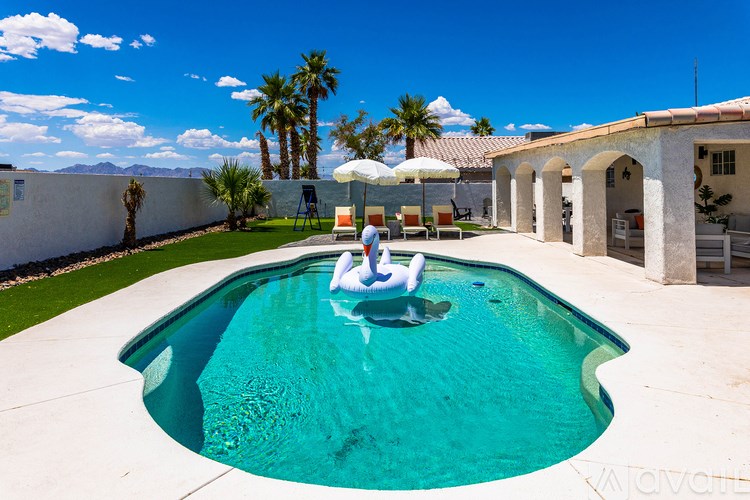 A person is sitting on a float in a pool.
