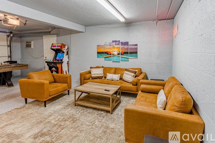 A living room with a couch, chair, and coffee table.