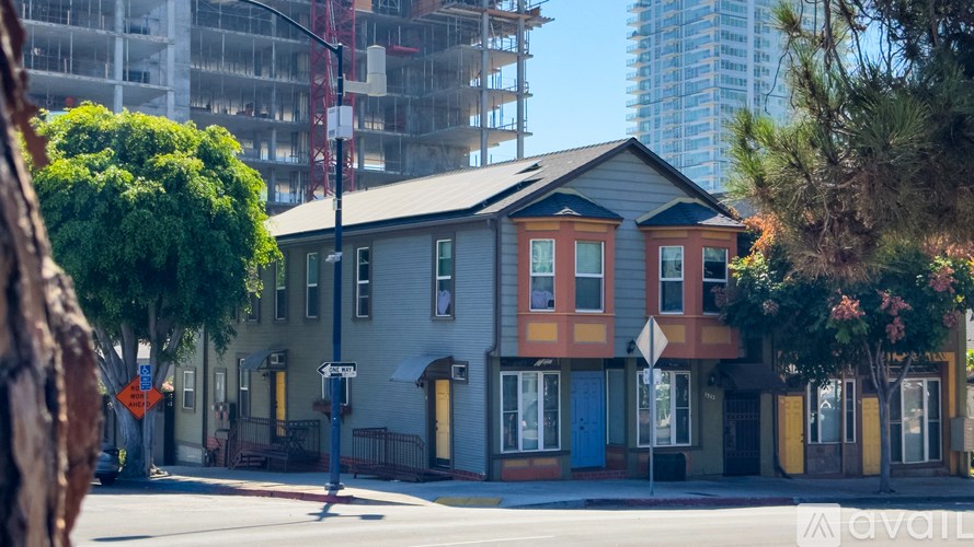 A row of houses with a construction site in the background.