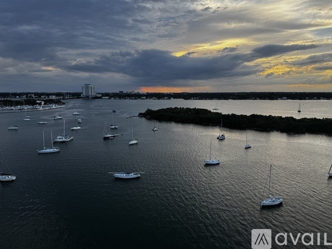 A large body of water filled with lots of boats.
