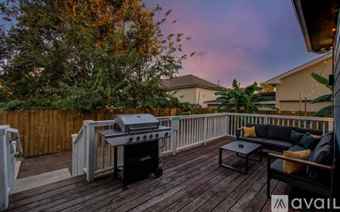 A backyard with a grill and seating area.
