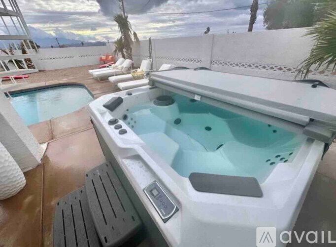 A hot tub with a control panel and a view of the outdoors.