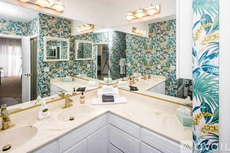 A bathroom with a mirror and a sink.
