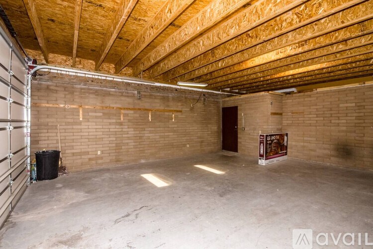 A room with a wooden ceiling and a poster on the wall.