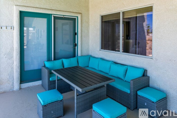 A patio with a table and chairs.