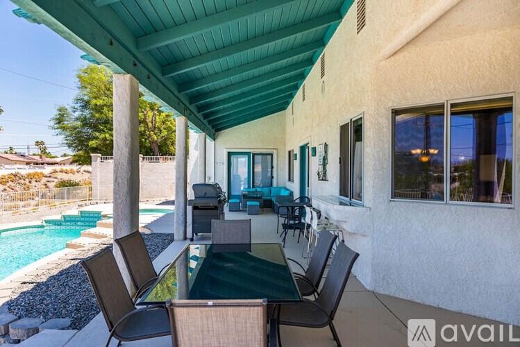 A patio with a table and chairs is available for rent.