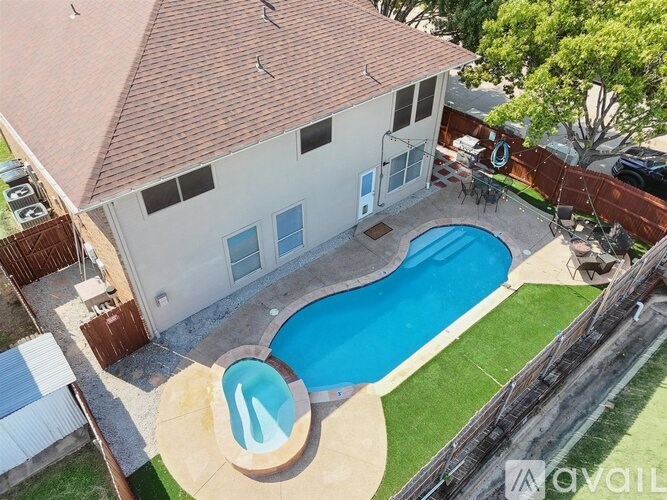 A house with a pool in the backyard.