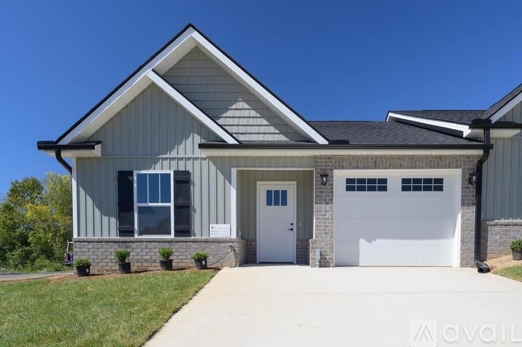 A modern house with a garage and a driveway.