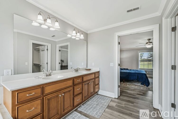 A dining room with a wooden table and chairs.