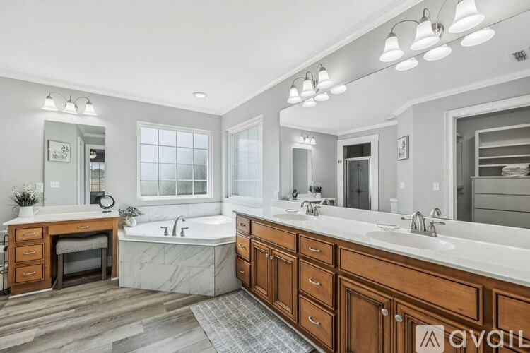 A kitchen with wooden cabinets and a dining table.
