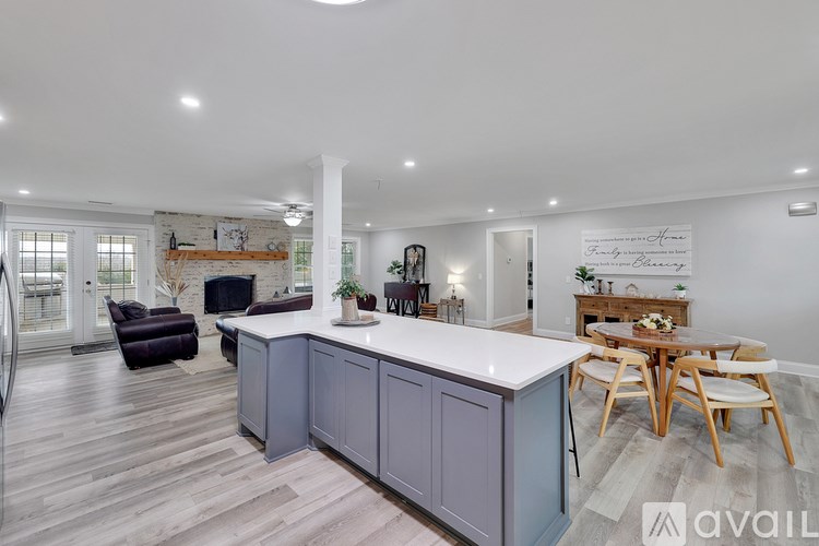 A kitchen with a bar area and a dining table.