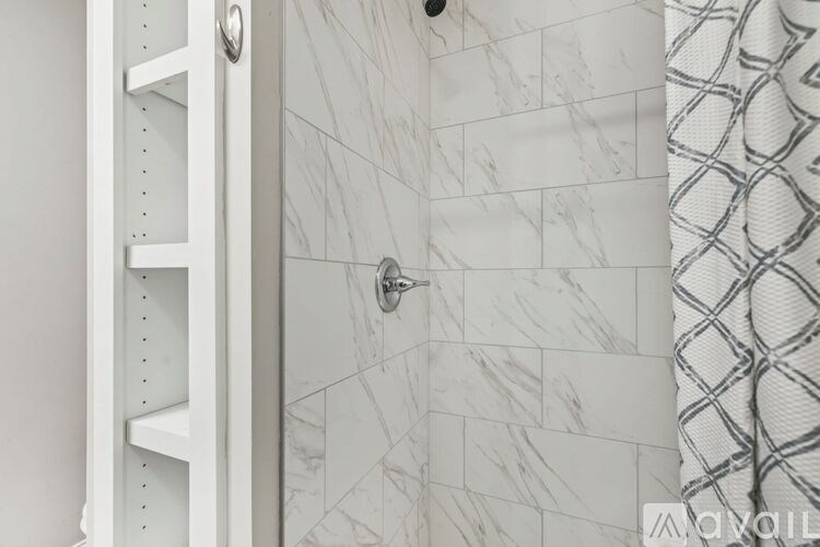 A kitchen with wooden cabinets and stainless steel appliances.