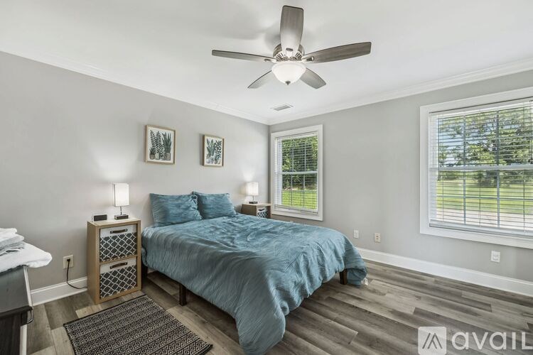 A kitchen with wooden cabinets and a white countertop.