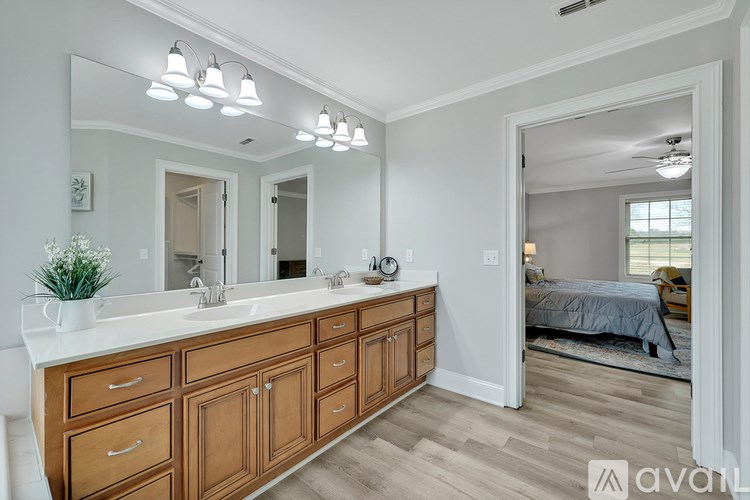 A bathroom with a vanity and a mirror.