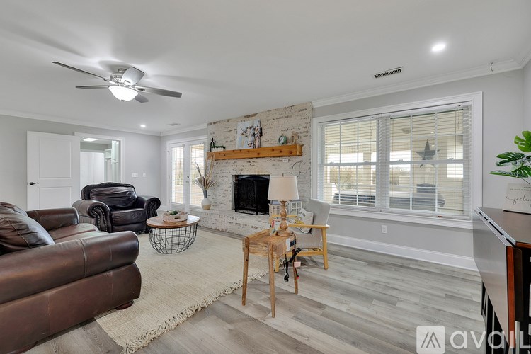 A living room with a fireplace and a couch.