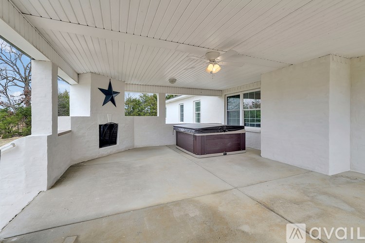 A room with a star decoration on the wall and a ceiling fan.