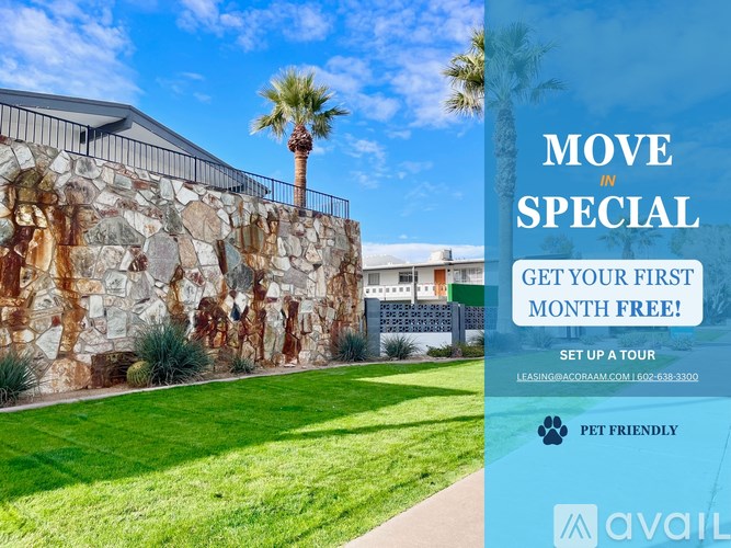 A stone wall with a palm tree and a sign offering a free first month for a move in special.