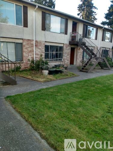 A building with a grassy area in front of it.