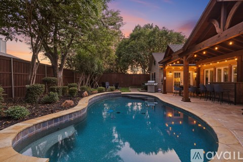 A house with a pool in the backyard.