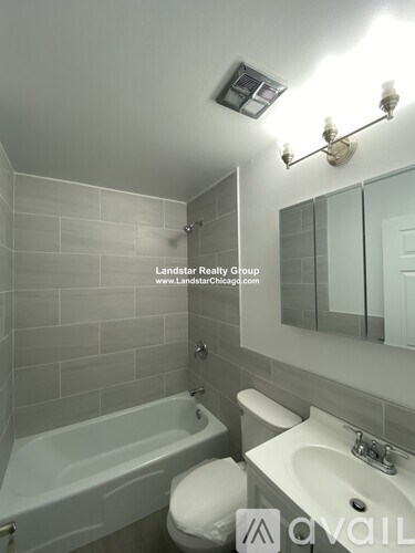 A white bathroom with Landstar Realty Group logo.
