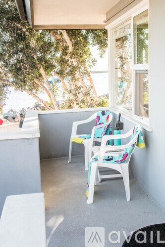 Two chairs are placed on a patio.