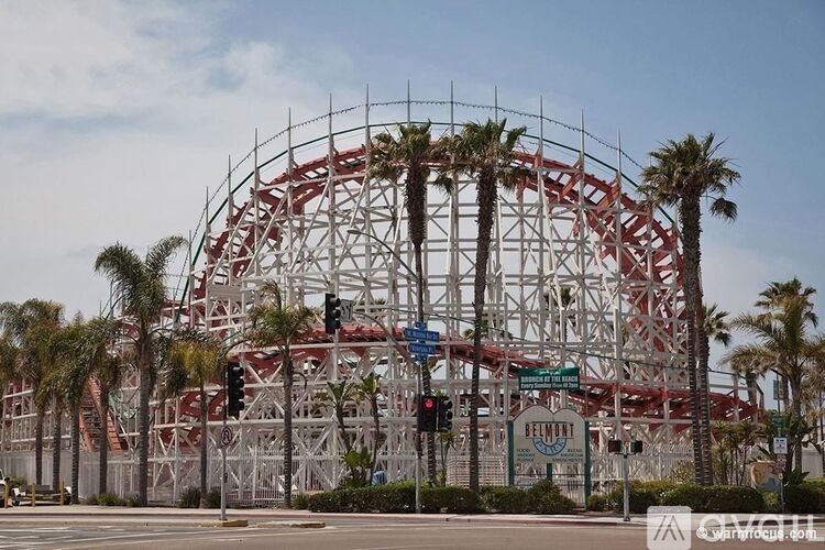 A roller coaster is under construction with scaffolding around it.